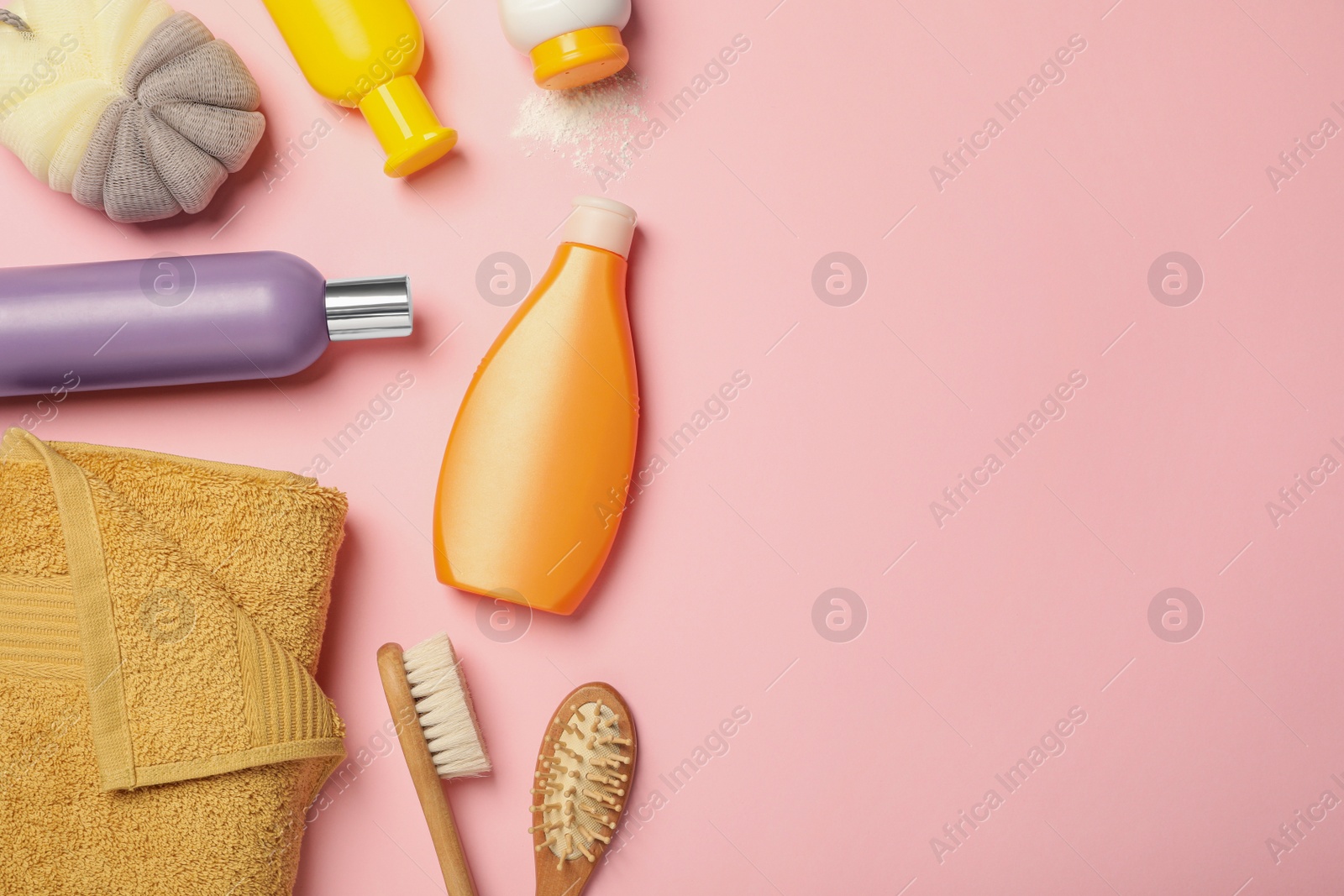 Photo of Flat lay composition with baby cosmetic products on pink background, space for text