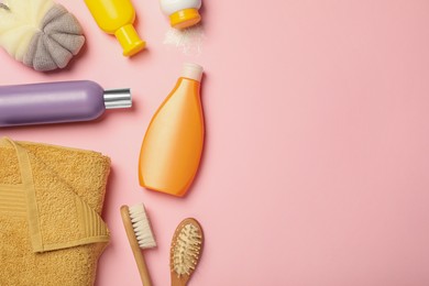 Flat lay composition with baby cosmetic products on pink background, space for text