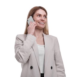 Beautiful happy businesswoman talking on smartphone against white background