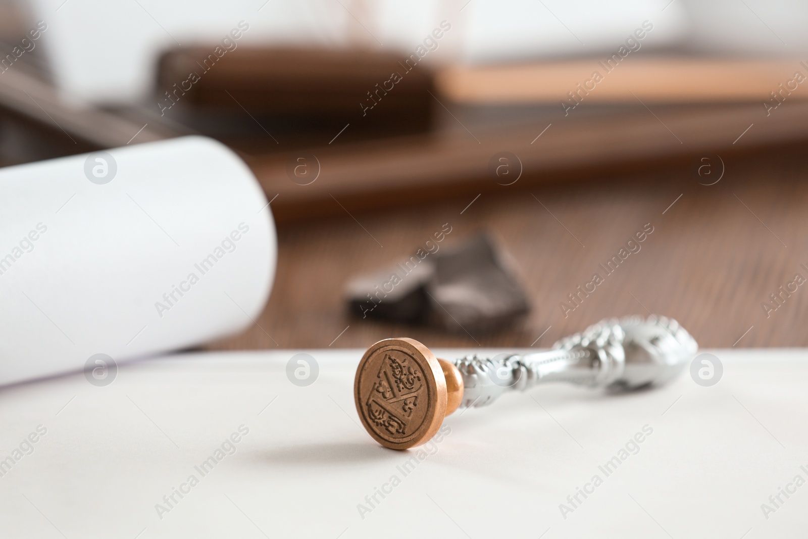 Photo of Vintage notary stamp and documents on table, closeup. Space for text