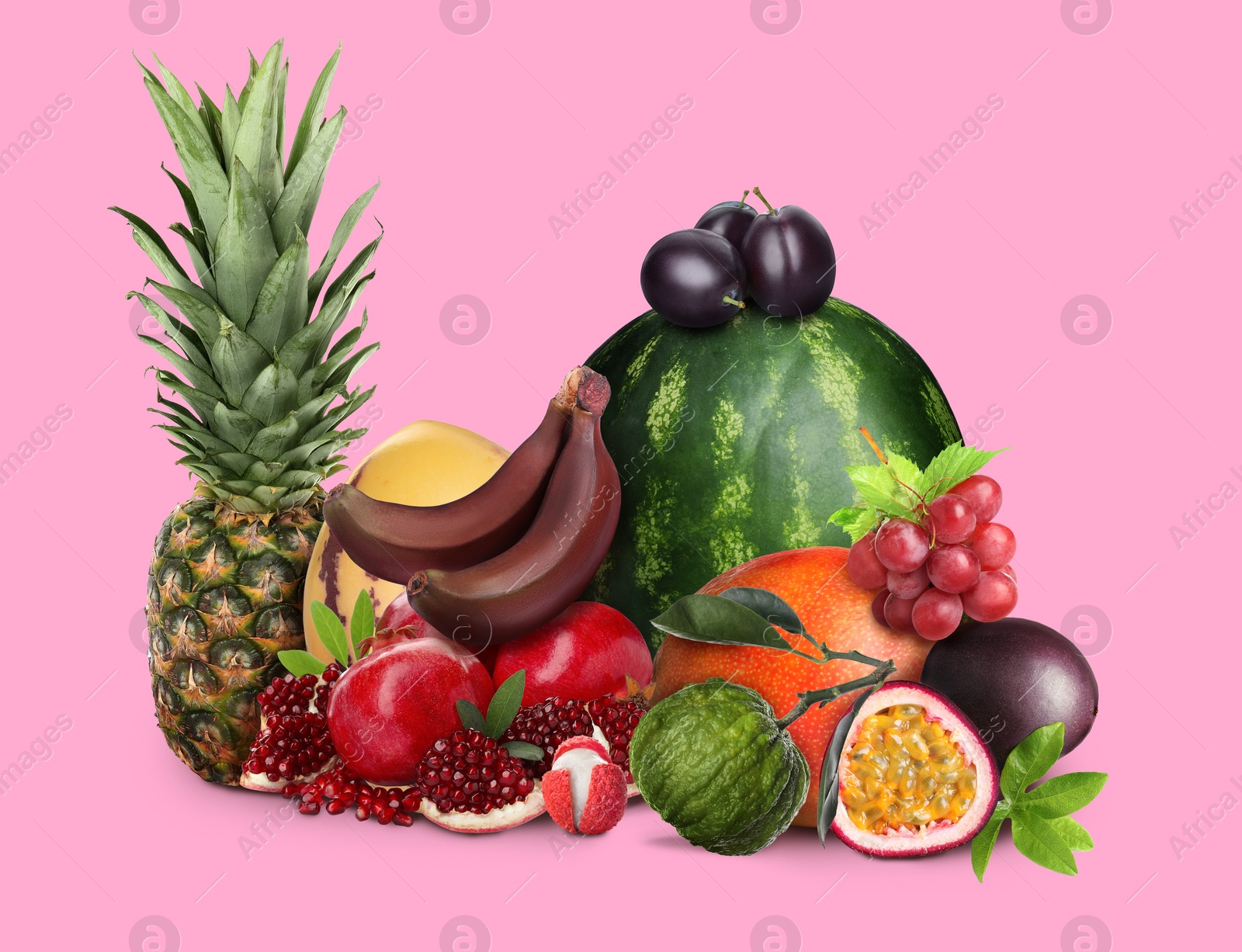 Image of Many different fresh fruits on pink background