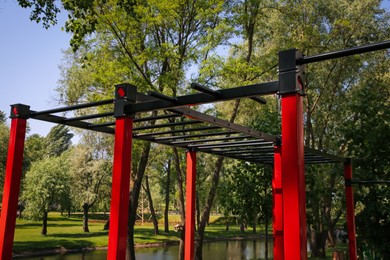 Photo of Empty outdoor gym with exercise equipment in park