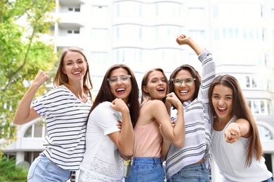 Happy women outdoors on sunny day. Girl power concept