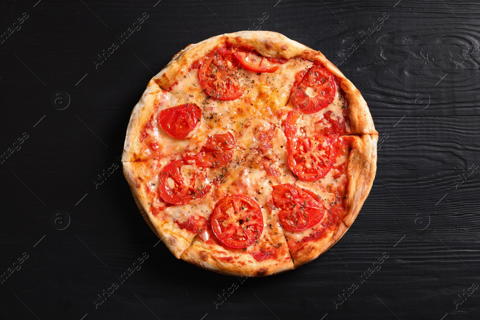 Photo of Hot cheese pizza Margherita on wooden table, top view