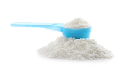 Photo of Powdered infant formula and scoop on white background. Baby milk