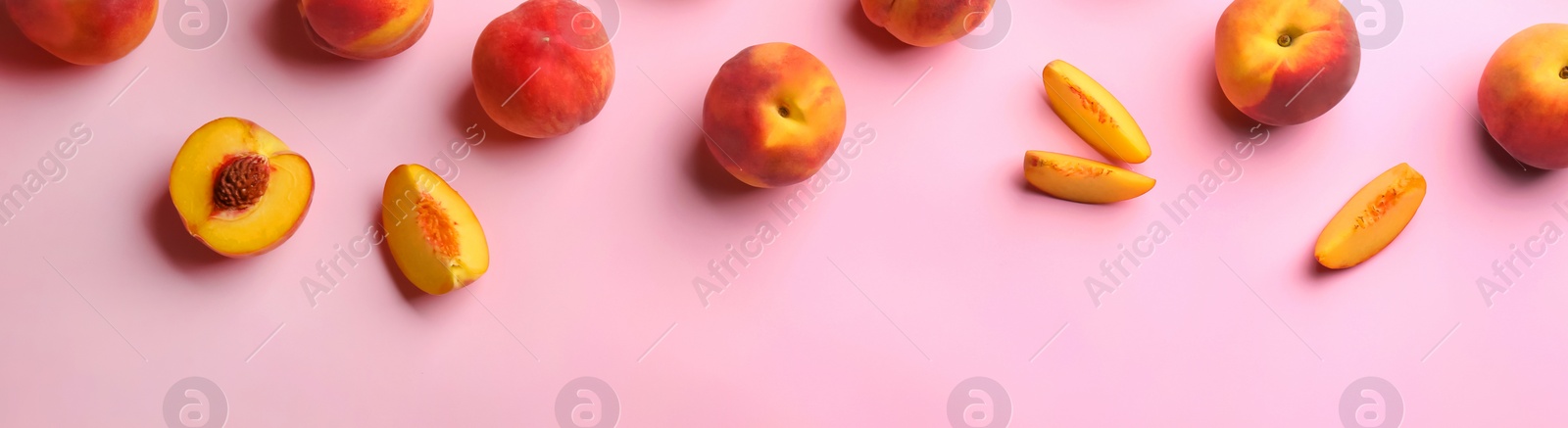 Image of Fresh ripe peaches on pink background, flat lay. Banner design with space for text