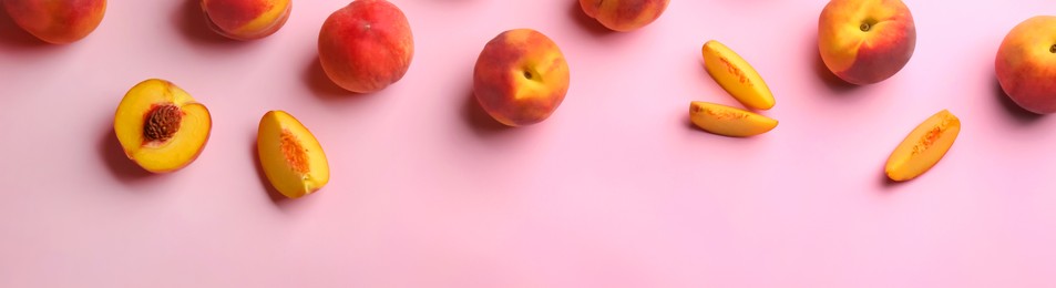 Fresh ripe peaches on pink background, flat lay. Banner design with space for text