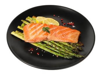 Photo of Tasty grilled salmon with asparagus, lemon and spices isolated on white