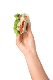 Photo of Woman holding delicious taco with meat and vegetables on white background, closeup