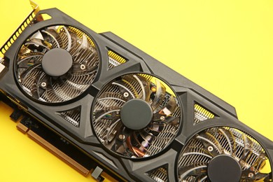 Photo of One graphics card on yellow background, above view