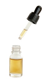 Little bottle with essential oil and dropper on white background