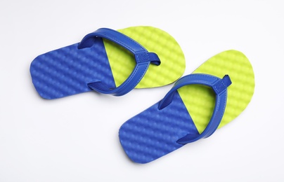 Pair of flip flops on white background, top view. Beach accessories