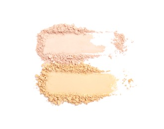 Photo of Swatches of different crushed face powders on white background, top view