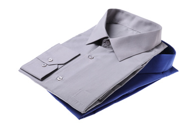 Photo of Stylish shirts isolated on white. Dry-cleaning service