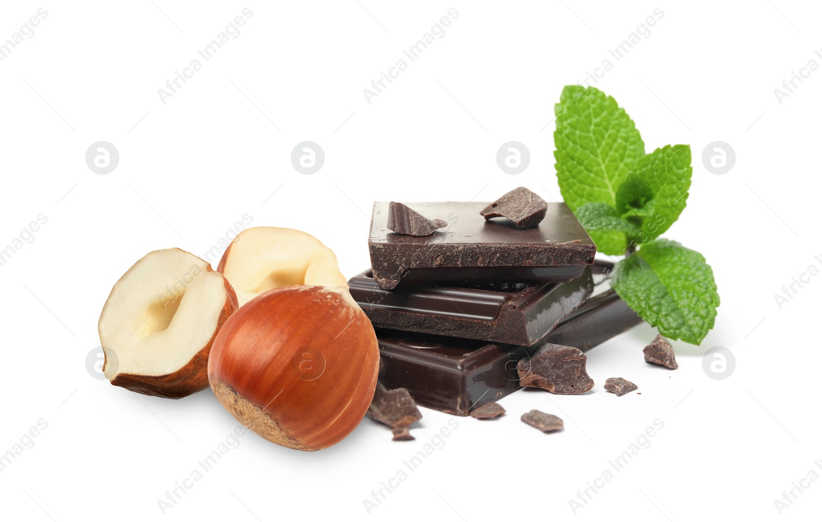 Image of Dark chocolate and hazelnuts isolated on white