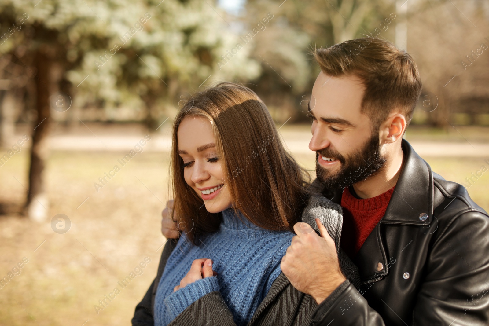 Photo of Portrait of cute young couple in park on sunny day