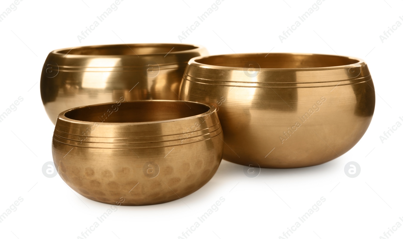 Photo of Three Tibetan singing bowls on white background
