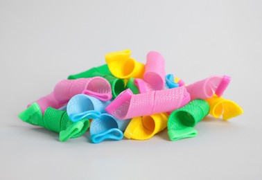 Photo of Many different hair curlers on white background