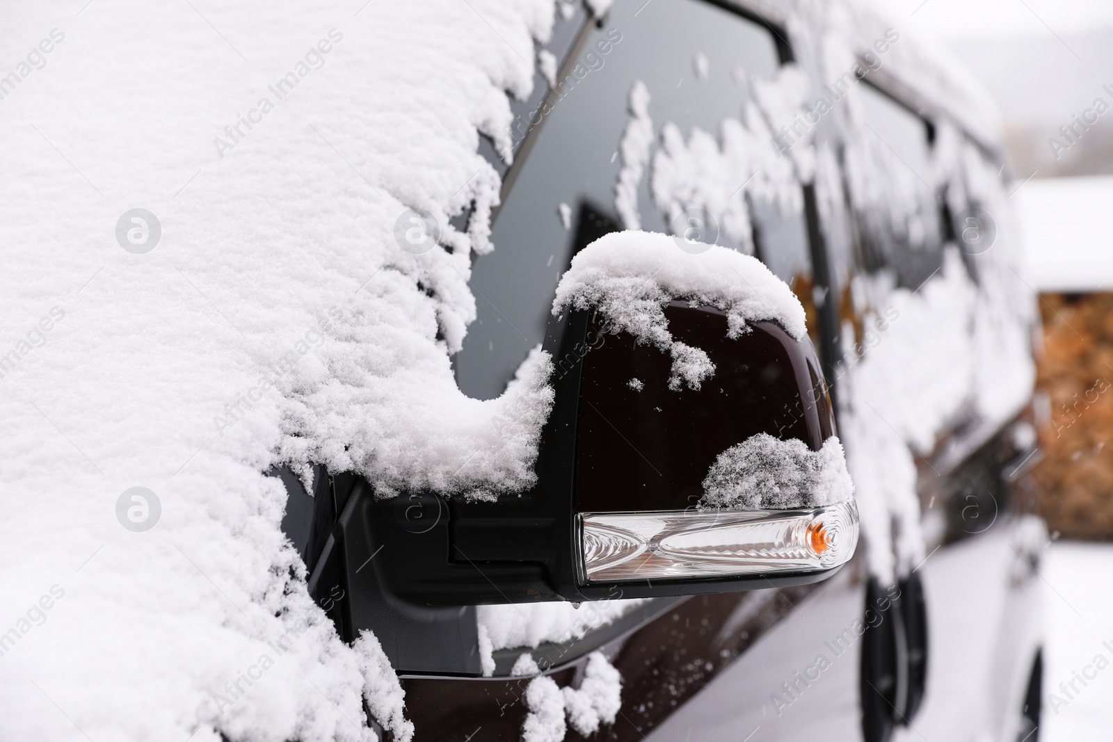 Photo of Car covered with snow after storm outdoors on beautiful winter day, closeup