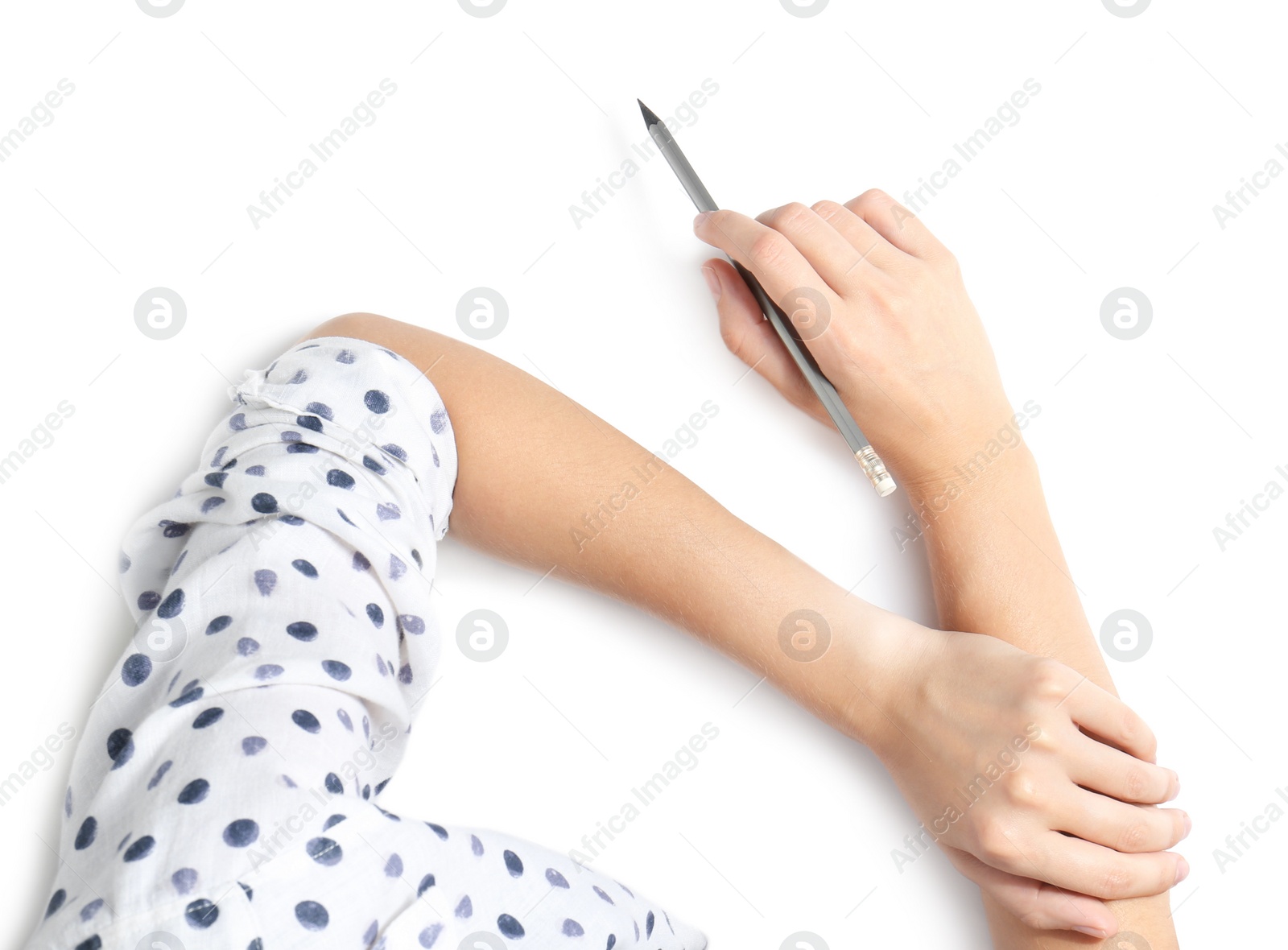 Photo of Woman holding pencil on white background, top view
