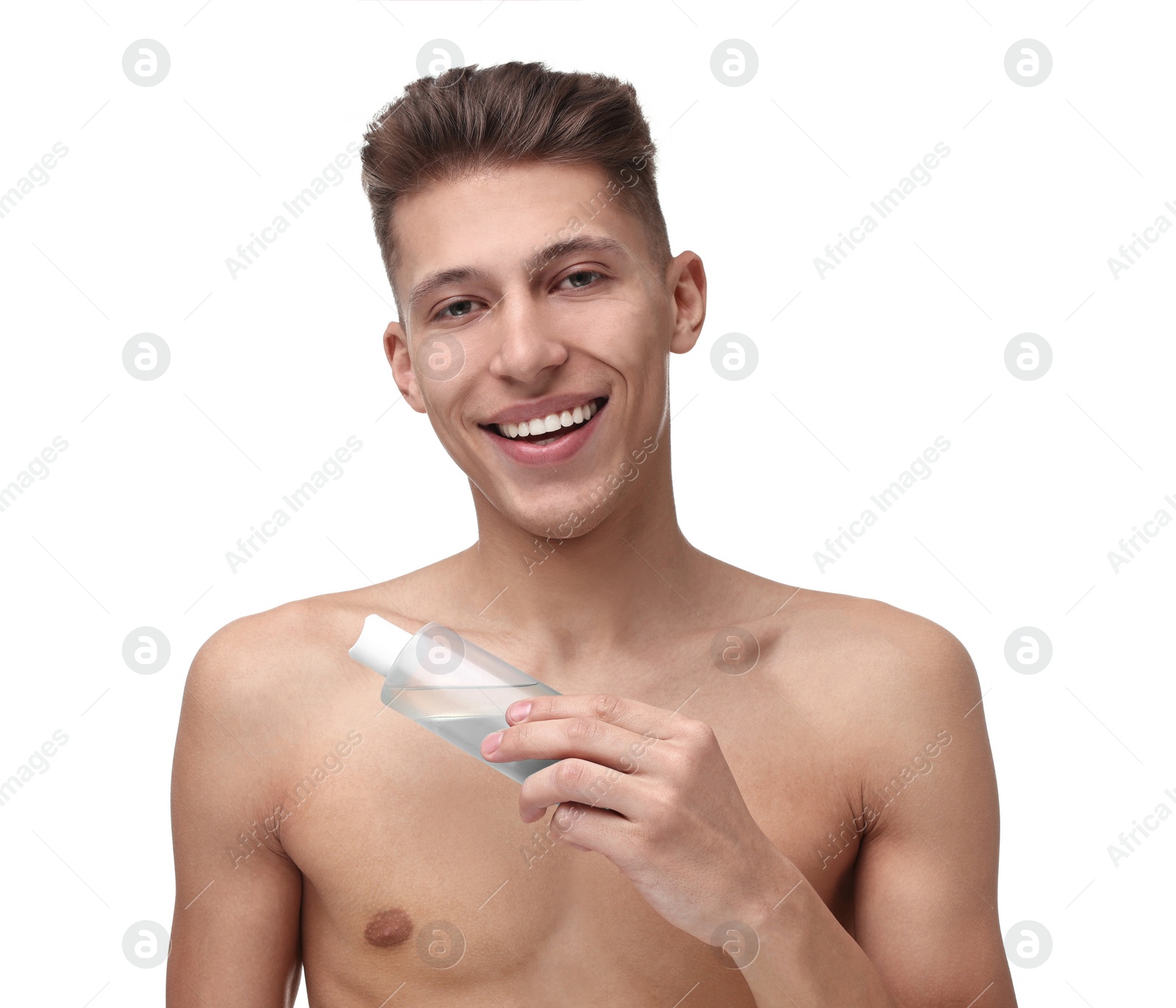 Photo of Handsome man applying lotion onto his body on white background