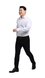 Photo of Businessman in formal clothes walking on white background