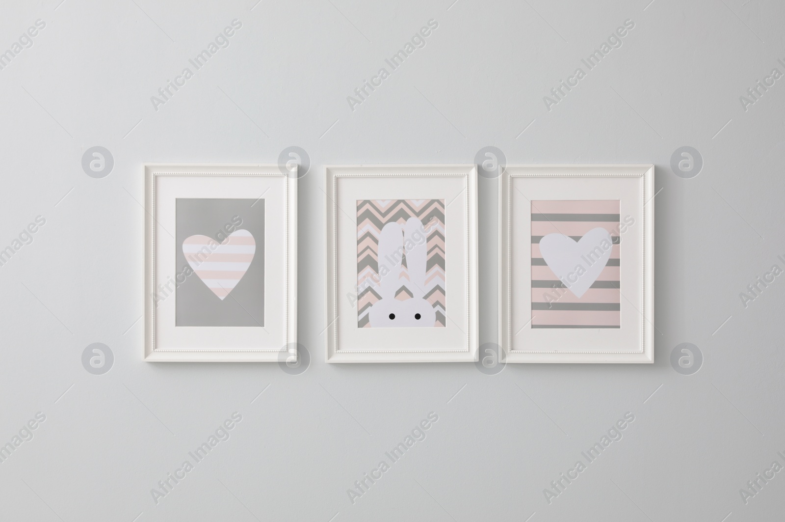 Photo of Different cute pictures on grey wall. Baby room interior