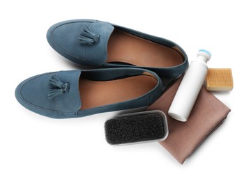 Photo of Stylish footwear and shoe care accessories on white background, top view