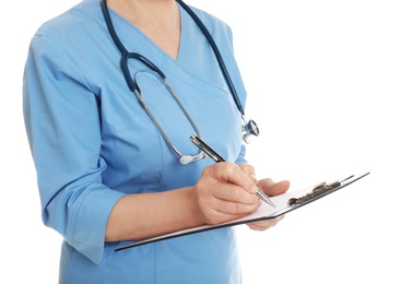 Photo of Closeup of female doctor in scrubs with clipboard isolated on white. Medical staff