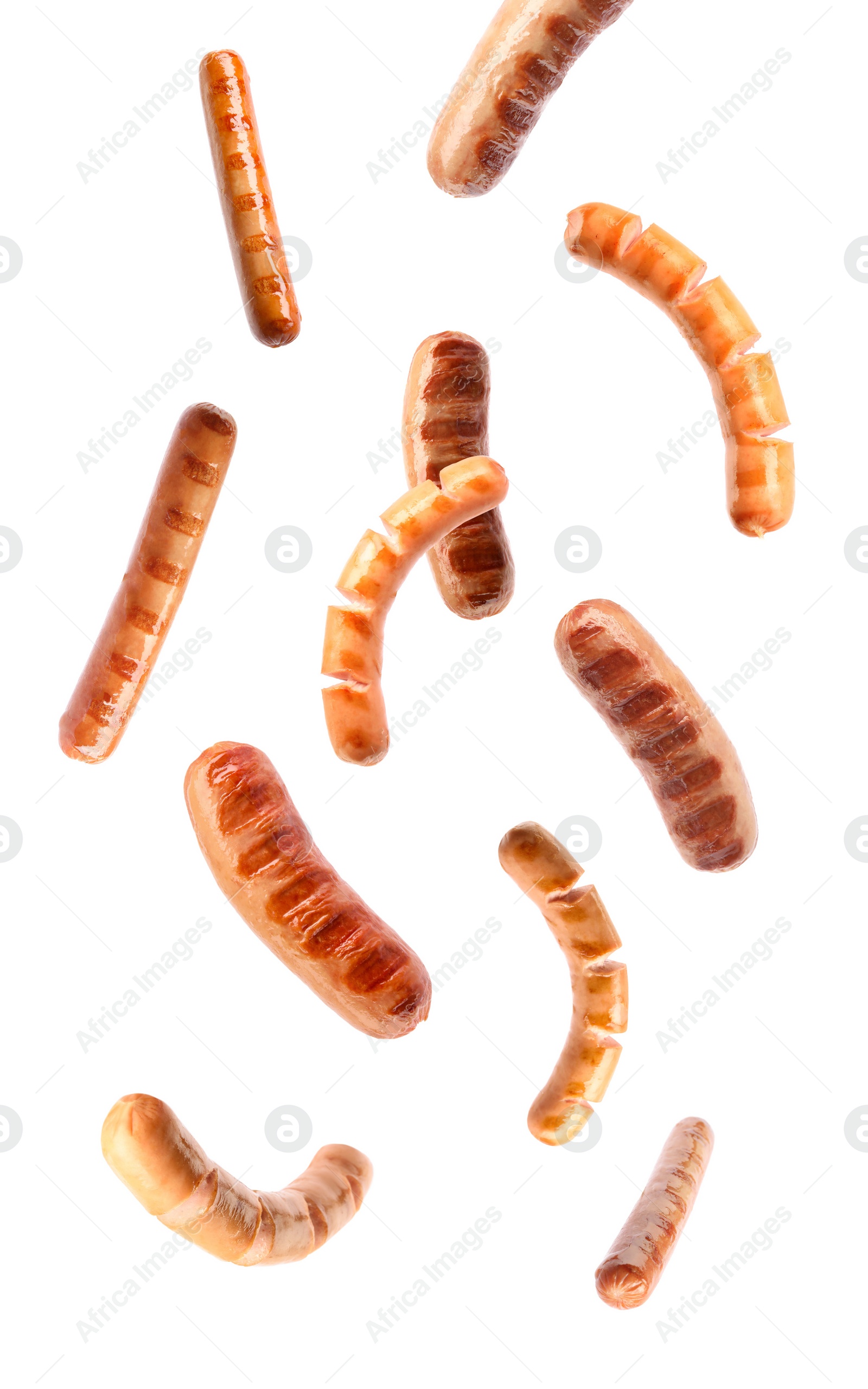 Image of Flying delicious grilled sausages on white background