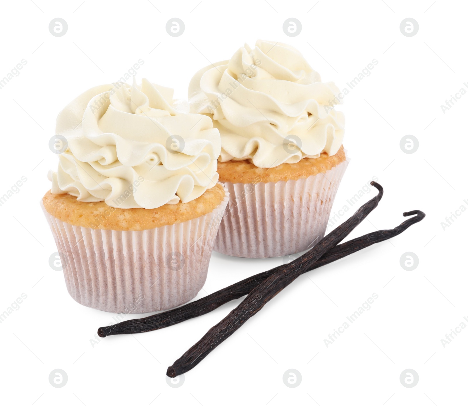 Photo of Tasty cupcakes with cream and vanilla pods isolated on white