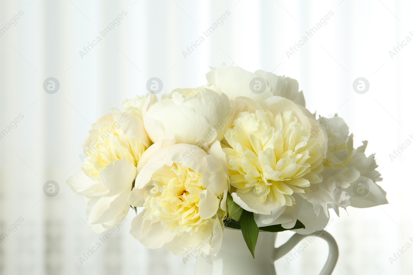 Photo of Bouquet of beautiful fresh peonies indoors, closeup