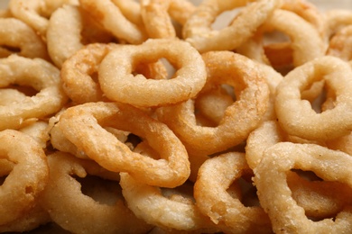 Photo of Freshly cooked onion rings as background