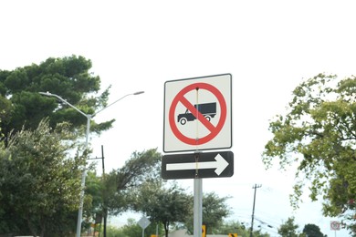 Different road signs on city street. Traffic rules