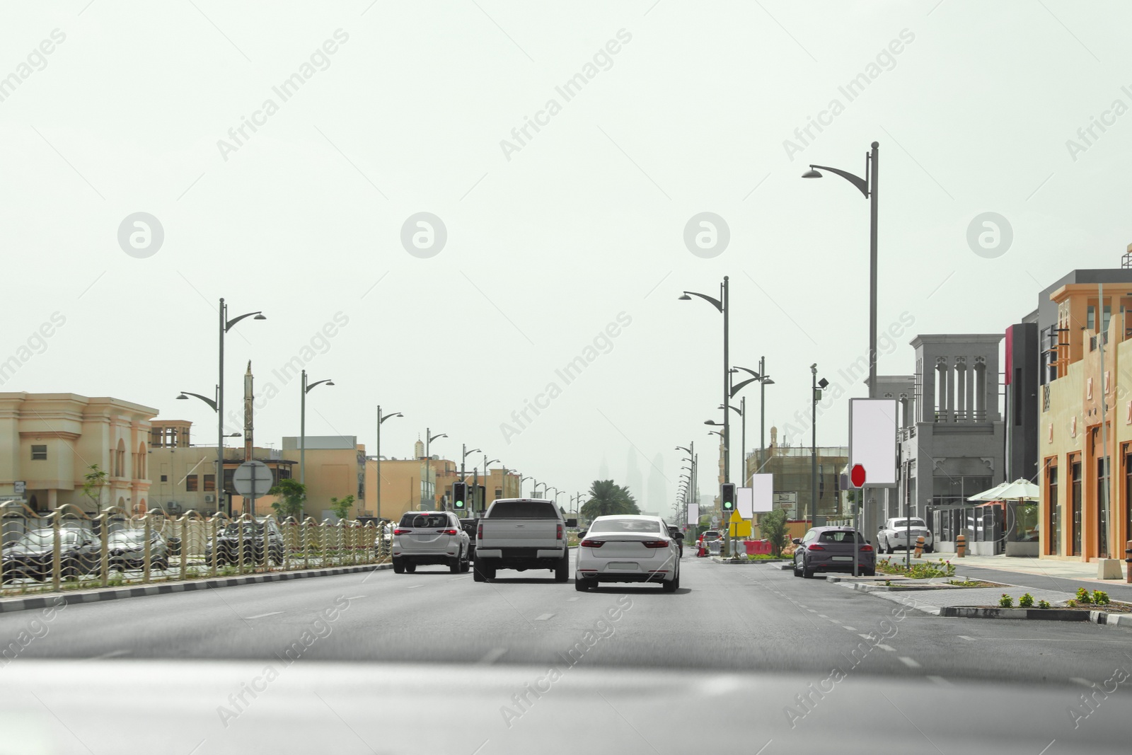 Photo of City traffic on sunny day, view from car