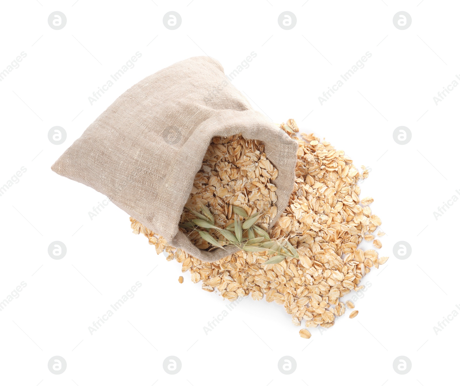 Photo of Overturned sack with oatmeal and florets isolated on white, top view