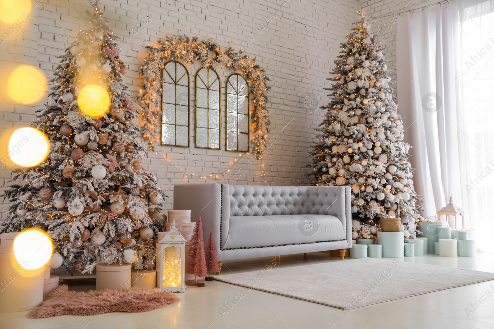 Photo of Beautiful interior of living room with decorated Christmas trees