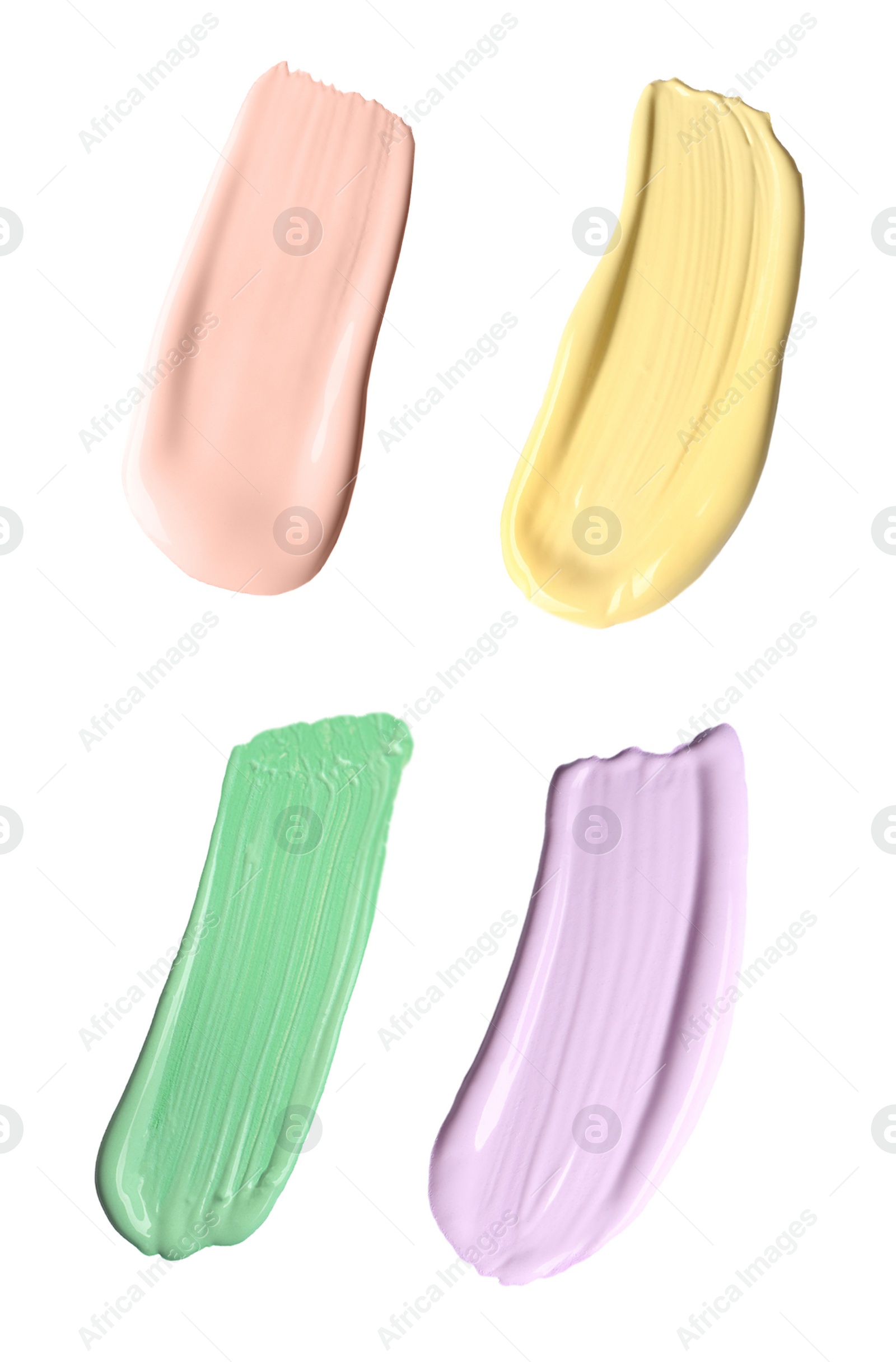 Image of Set with strokes of color correcting concealers on white background, top view