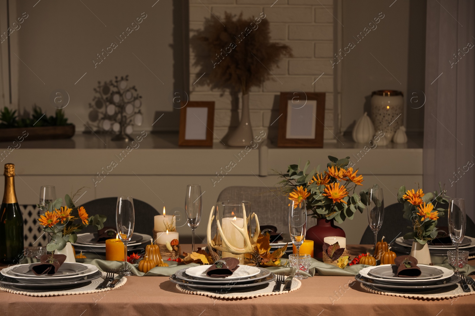 Photo of Table set with beautiful autumn decor for festive dinner in room