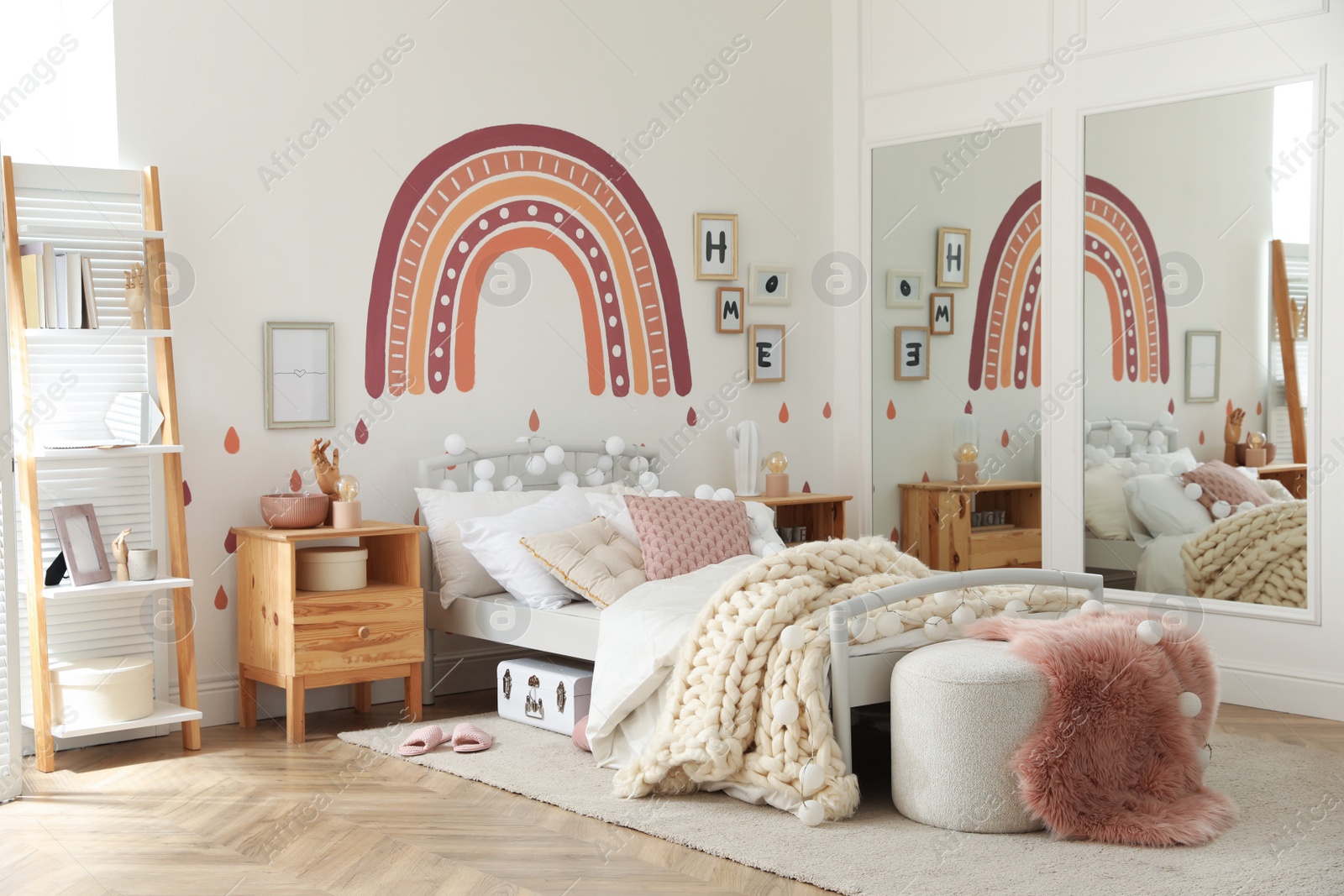 Photo of Stylish child's room interior with comfortable bed