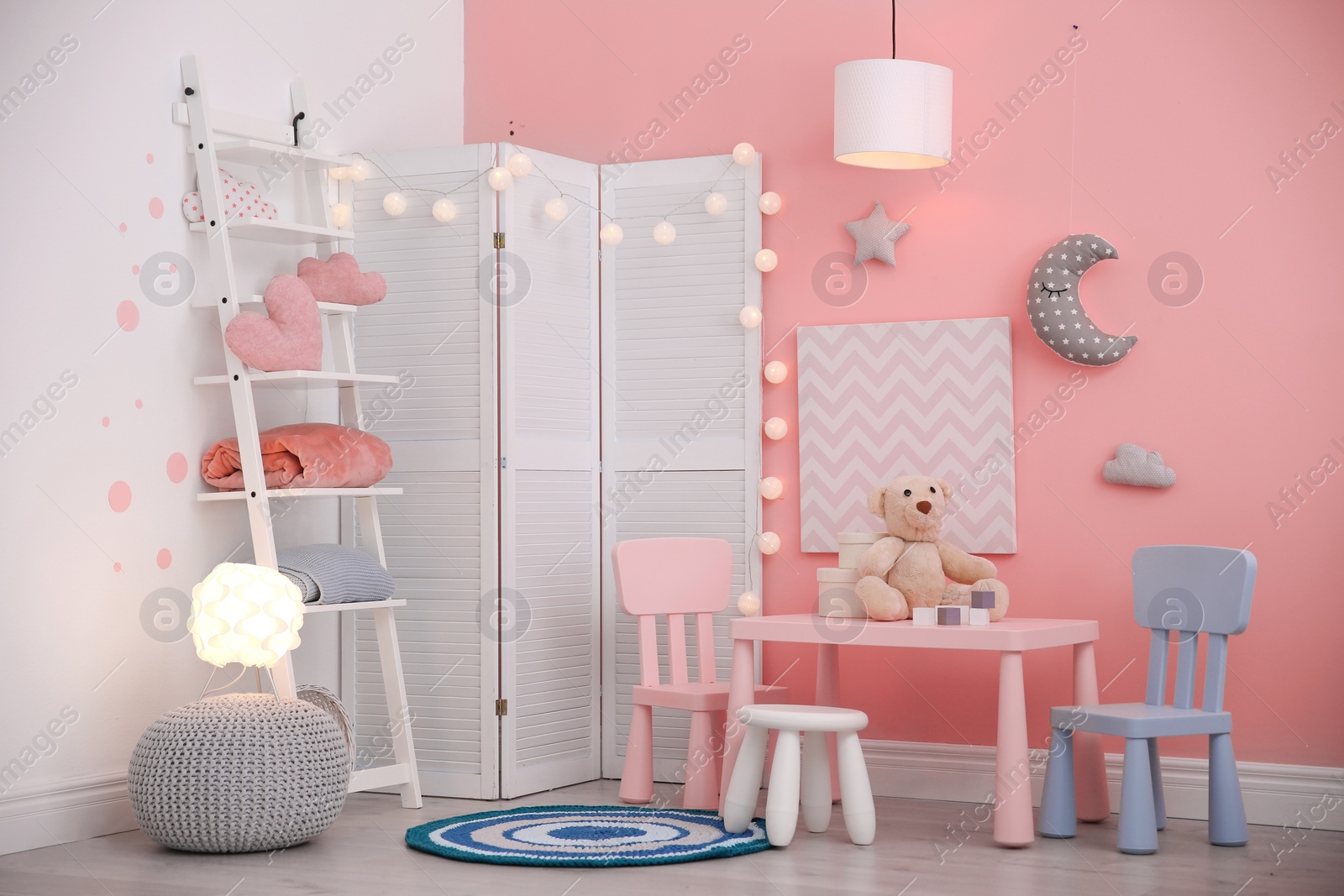 Photo of Modern child room interior with toys and decorations