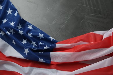 Photo of Flag of USA on black table, top view. Space for text