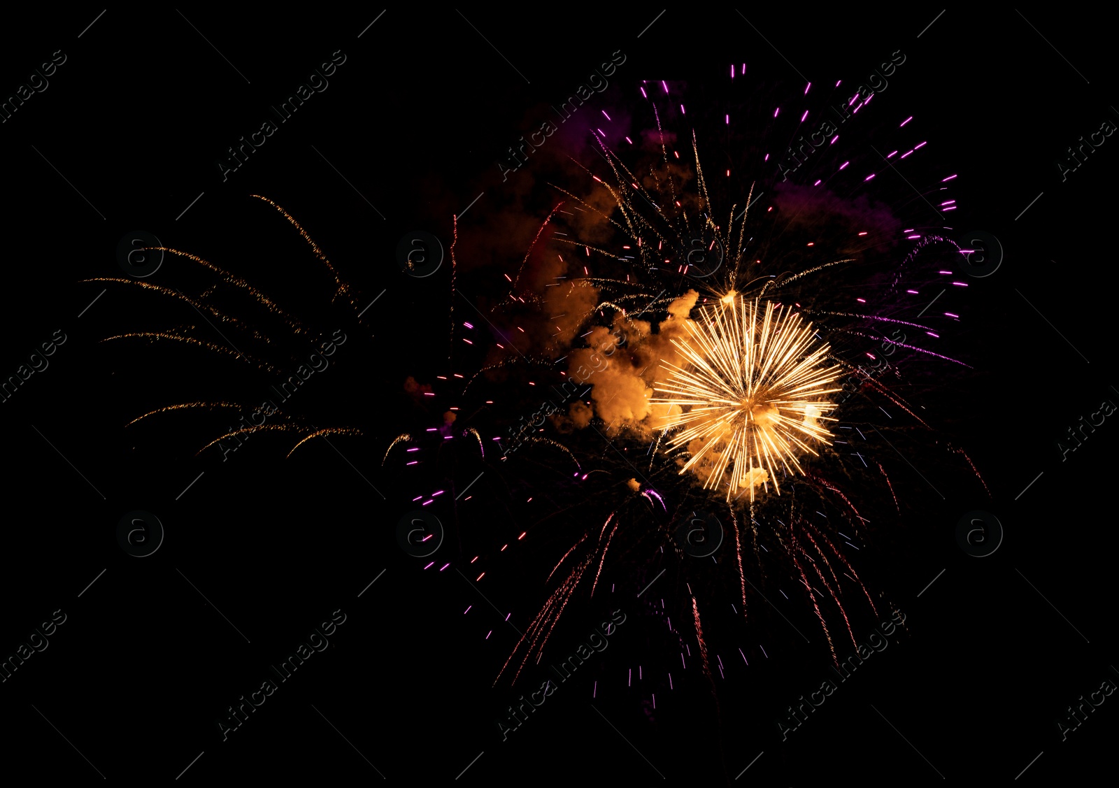 Image of Beautiful bright fireworks lighting up night sky