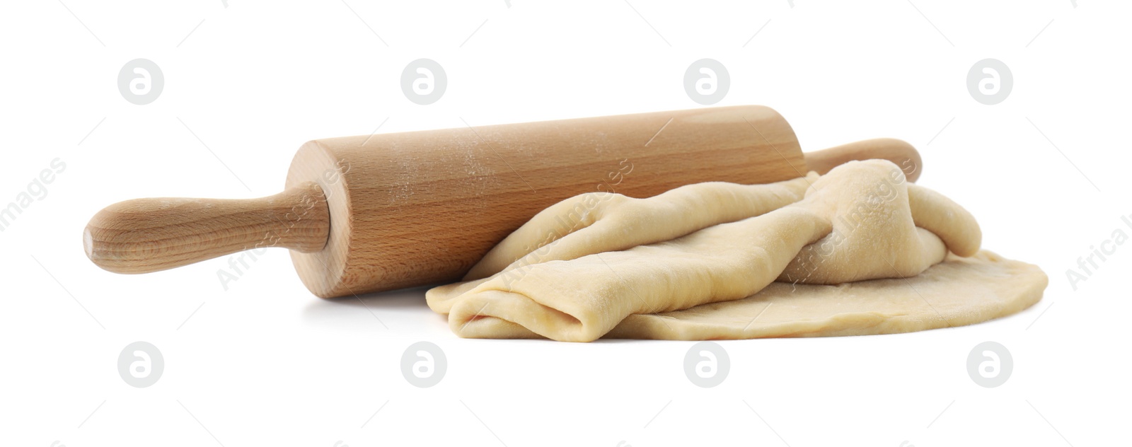 Photo of Raw dough and rolling pin isolated on white