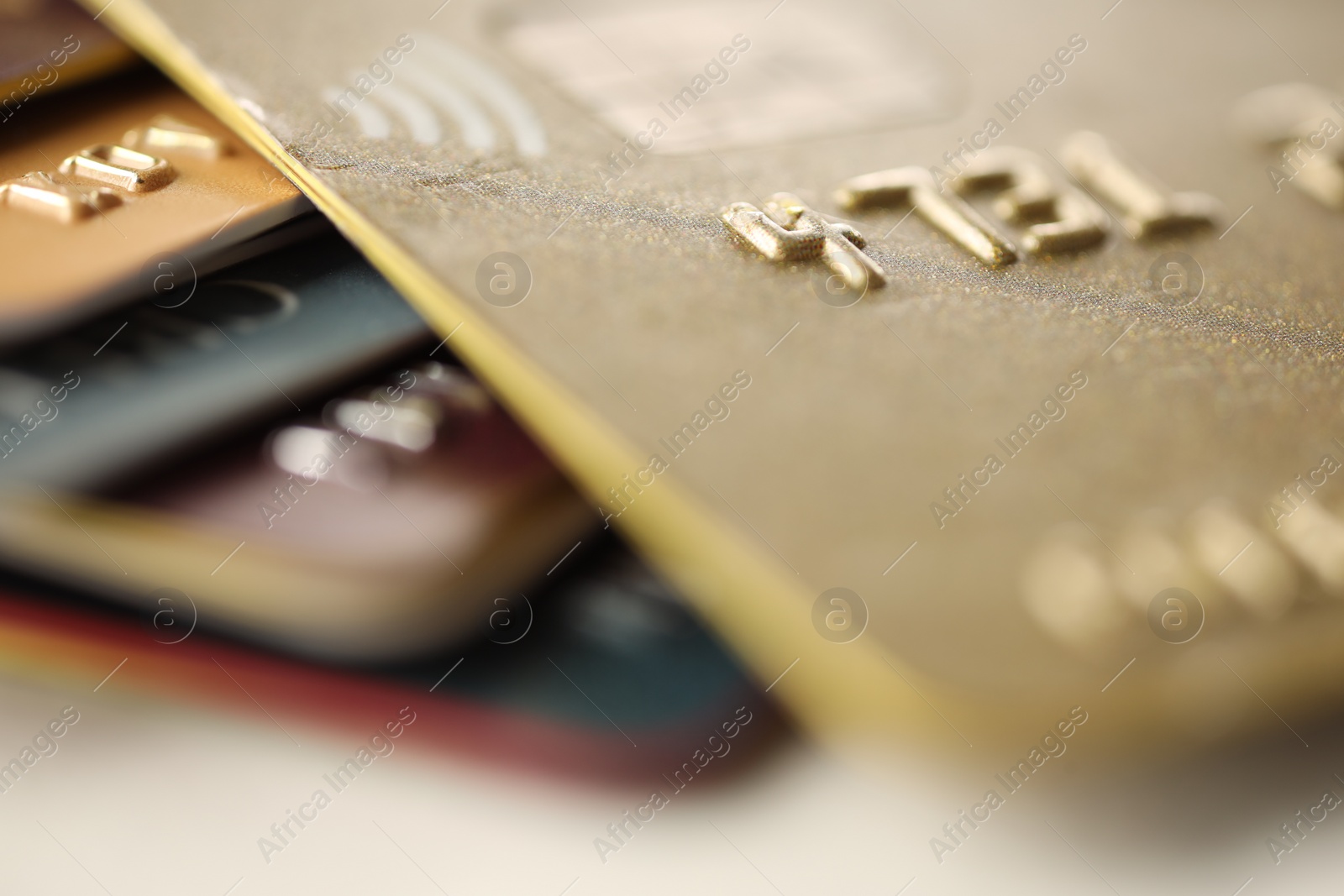 Photo of Plastic credit cards on table, macro view