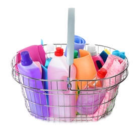 Metal shopping basket with different household chemicals on white background