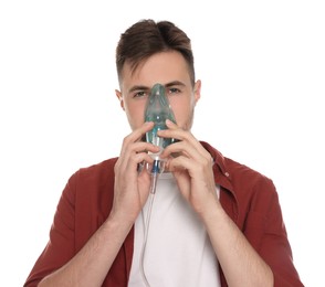 Photo of Man using nebulizer for inhalation on white background