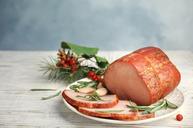 Photo of Delicious ham served on white wooden table. Christmas dinner