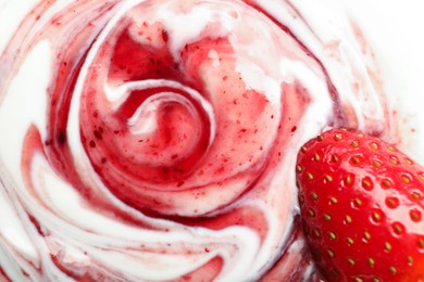 Photo of Tasty yoghurt with jam and fresh strawberry as background, top view