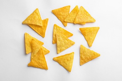 Flat lay composition of tortilla chips (nachos) on white background